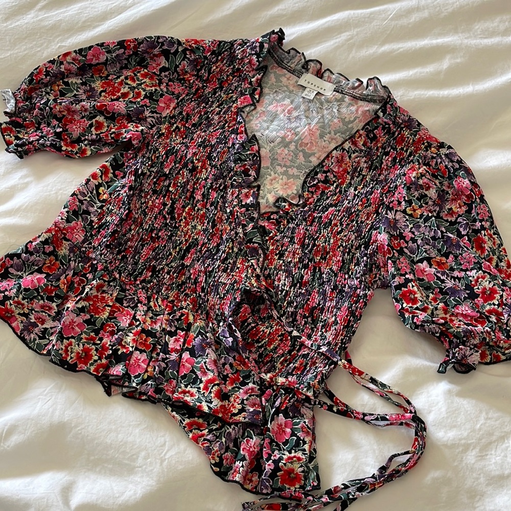 Never worn floral top with cross body tie on the side